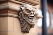 carved gargoyle on a historic buildings facade
