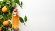 Top view of orange juice bottle with oranges in a clean white backdrop with leaves, Generative AI.
