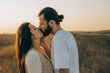 © Ananass - an emotional kiss between two partners on an evening walk