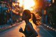 © Olivia - Young asian woman jogging in the street, blur city background. Sports and active healthy lifestyle concept