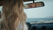 © stockbusters - Gorgeous woman applying lipstick looking in car mirror close up. Lips makeup