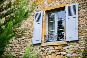 Window of old village stone house in France