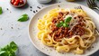 fresh pasta with hearty bolognese and parmesan cheese   