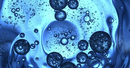 slow motion macro of floating micro particles molecules in liquid are analyzed with microscope by ch