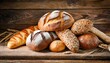 heap of fresh baked bread on wooden background