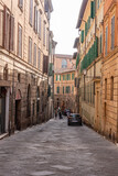 Fototapeta Miasta - Via delle Sapienza in downton Siena