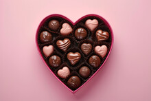 Pink Heart-shaped Box With Delicious Chocolates On A Pink Background. St Valentines Day Concept. Copy Space.