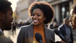 © anandart - mature professional politician woman being interviewed live by a tv broadcast channel with microphones and cameras on a press conference outside on the city street