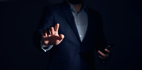 Businessman hand touching virtual screen