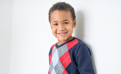 Cute happy 3 year old American boy smiling for the camera