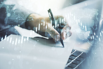 Aufkleber - Multi exposure of abstract creative financial chart with world map and with hand writing in notebook on background with laptop, research and analytics concept