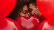 Young Couple Flirting and Kissing Behind Heart Shaped Balloon