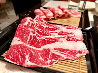 raw wagyu meat on bamboo for hot pot/shabu shabu