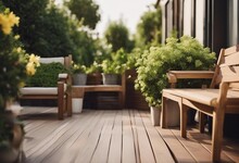 Wood Deck Outdoor Furniture At The Modern Terrace With  Floor And Green Potted Plants
