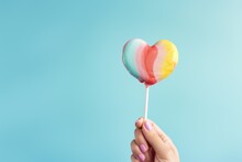 Colorful Lollipop In Shape Of Heart On Blue Background