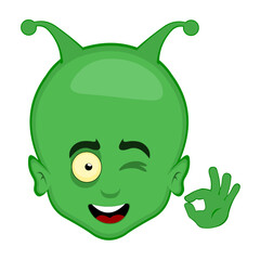 Wall Mural - vector illustration head alien or extraterrestrial cartoon winking eye and with his hand making an ok or perfect gesture