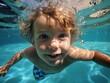 © keystoker - Close-up of the child boy during a swimming lesson or while they are playing in the pool