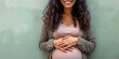 © Gabriela - Smiling, pregnant Latin woman