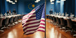 The American flag prominently displayed in a modern conference room