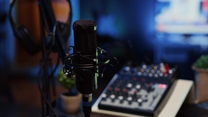 Wall Mural - Close up shot of professional microphone used to record podcast conversations for online livestreaming channel. High quality sound capturing and recording gear in apartment studio