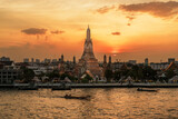 Fototapeta Koty - Wat Arun Temple in sunset, Temple of Dawn near Chao Phraya river. Landmark and popular for tourist attraction and Travel destination in Bangkok, Thailand and Southeast Asia concept