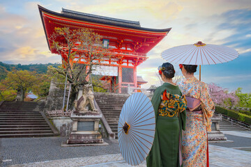 Wall Mural - Young Japanese woman in a traditional Kimono dress at Kiyomizu-dera temple in Kyoto, Japan