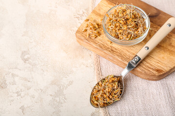 Wall Mural - Bowl and spoon with sprouted wheat on grunge table