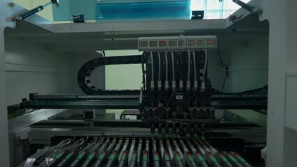 Poster - Automatic pick and place machine is installing components on circuit board. Creative. Assembly line on electronics and circuit board manufacturing factory.