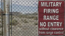 High Quality 3D CGI Render Of A Chainlink Fence At A High Security Installation In A Desert Scene, With A Military Firing Range No Entry Sign