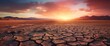 Global warming concept.Soil drought cracked landscape on sunset sky.Dry cracks in the land, serious water shortages.Drought concept.
