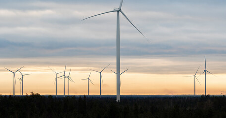 Wall Mural - Windmills on a cold winter morning with moody sky in the background