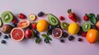 © Shanti - a variety of fruits are arranged on a pink surface, including oranges, kiwis, and strawberries.