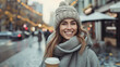 Happy young woman with a smile in a gray vintage coat with a knitted cap with coffee walking outdoors in the city. Made with generative ai