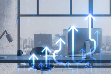 Poster - Close up of office workplace with growing blue business chart arrows on blurry window with cirty view background. Success, trend and financial growth concept. Double exposure.