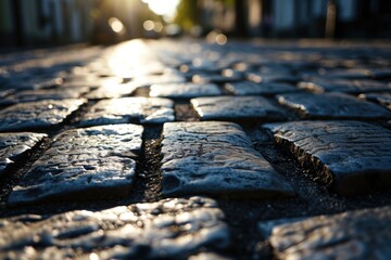 Aufkleber - A picturesque cobblestone street with the sun setting in the background. Perfect for capturing the charm of an old town or historic city. Ideal for travel brochures or website banners
