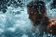 Athletic male figure surrounded by water, close up portrait, concept of strength, freedom, energy, freshness.