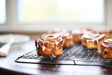 Sticker - cinnamon rolls with icing on a wire rack