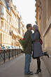 © fStop - Young couple kissing in a city street
