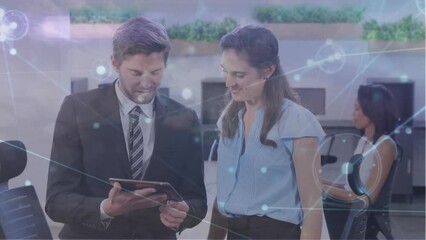 Canvas Print - Animation of network of connections over caucasian colleagues using tablet in office