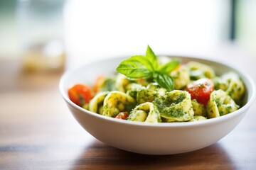 Poster - bowl of cheese-stuffed tortellini with pesto drizzle