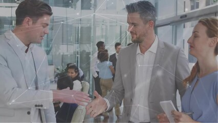 Wall Mural - Animation of network of connections over diverse colleagues shaking hands in office