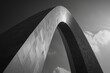A black and white photo of a large arch. Suitable for architectural designs and historical references