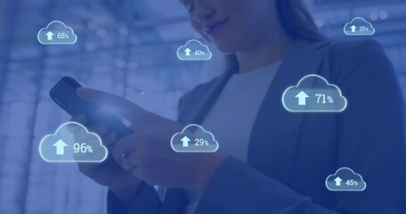 Poster - Animation of cloud icons with growing number over caucasian businesswoman using smartphone