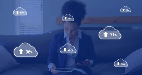 Poster - Animation of cloud icons with growing number over biracial businesswoman using smartphone