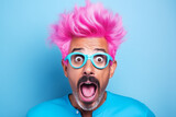Fototapeta  - Pink hair. Young shocked guy wearing casual clothes and glasses celebrating shocked of surprised open eyes wide. What just happened. Portrait of a shocked young man wears glasses on colour background.