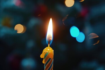 Poster - A lit birthday candle placed in front of a blurry background. Suitable for various celebratory occasions