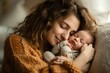 © fledermausstudio - Loving mom carying of her newborn baby at home