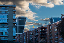 Architectural Contrast In A Cityscape With Apartment Buildings And Modern Office Towers In Financial Districts In The City Of Madrid In Spain