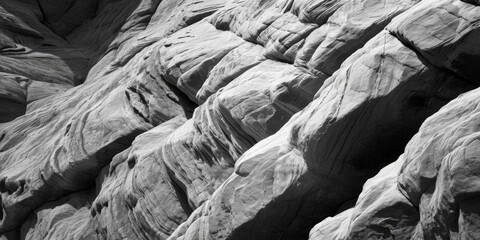 Poster - A black and white photo capturing the beauty of a rock formation. This image can be used to add a touch of elegance and simplicity to various projects