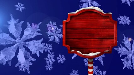 Wall Mural - Animation of red wood sign over falling snowflakes on blue background, copy space